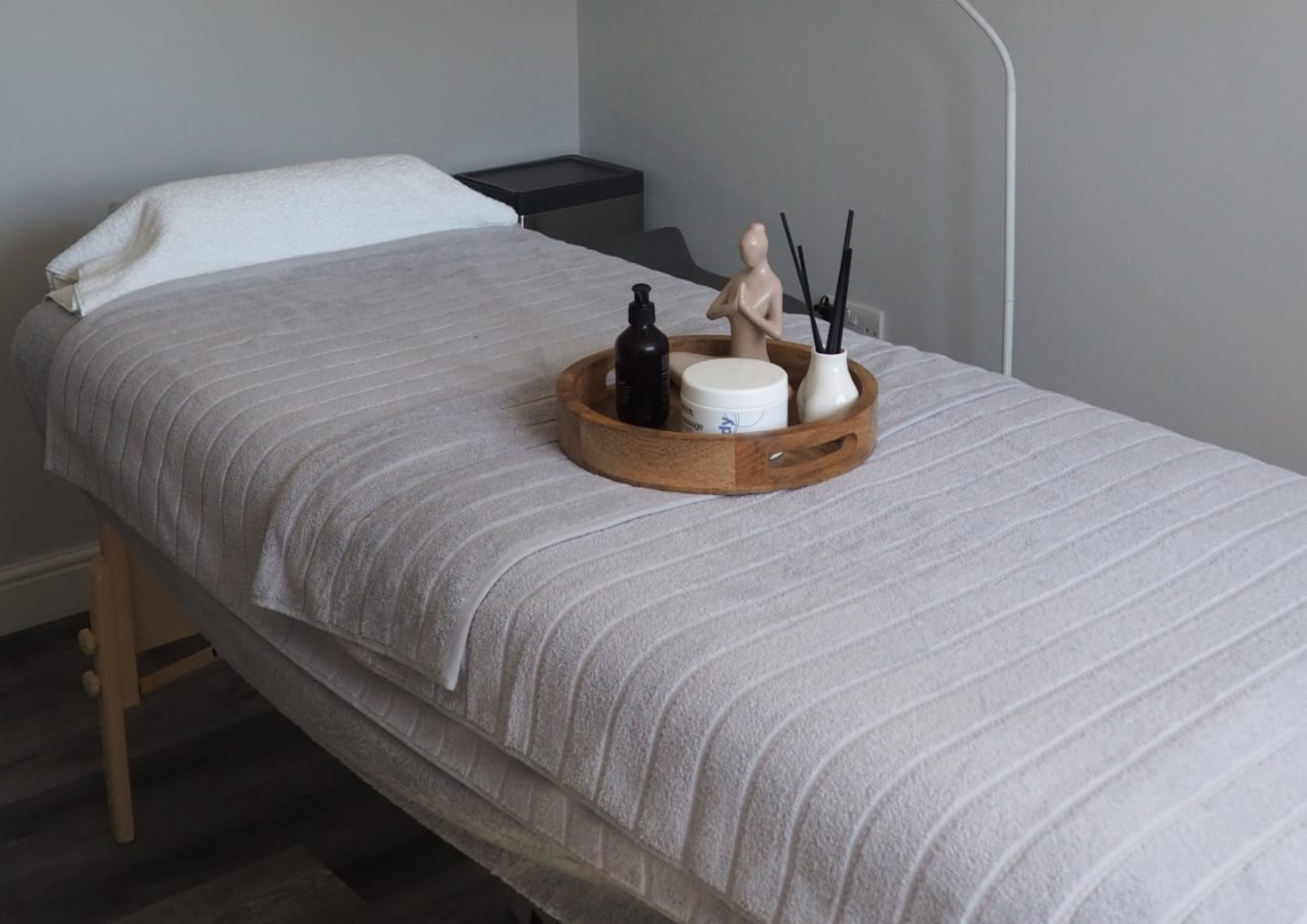 Treatment couch with fresh towels and oils in the calm private studio at Lafeli Beauty, Willaston